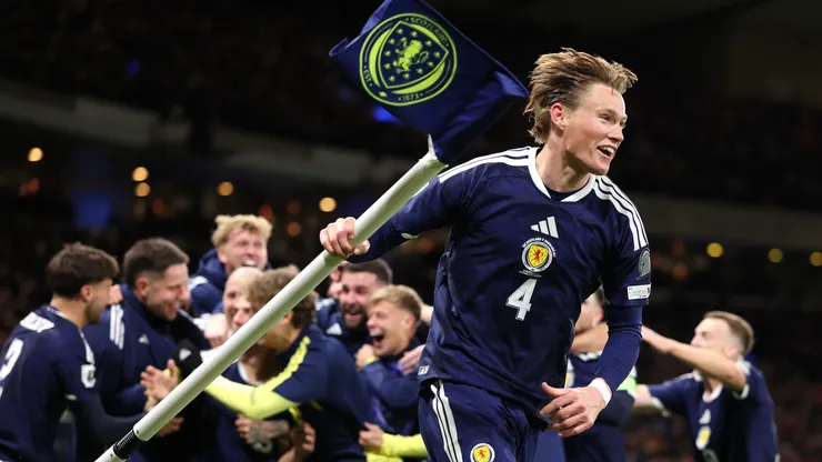 Scotland player Scott McTominay celebrates with the corner flag.