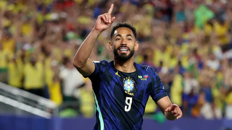 Matheus Cunha celebrates a goal for Brazil.