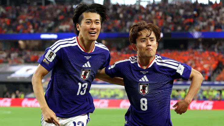 Keito Nakamura #13 of Japan celebrates a goal with Takefusa Kubo #8.