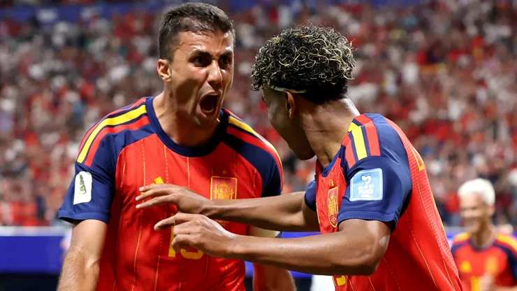 Lamine Yamal #19 of Spain celebrates with teammate Rodri #16 after scoring a goal.