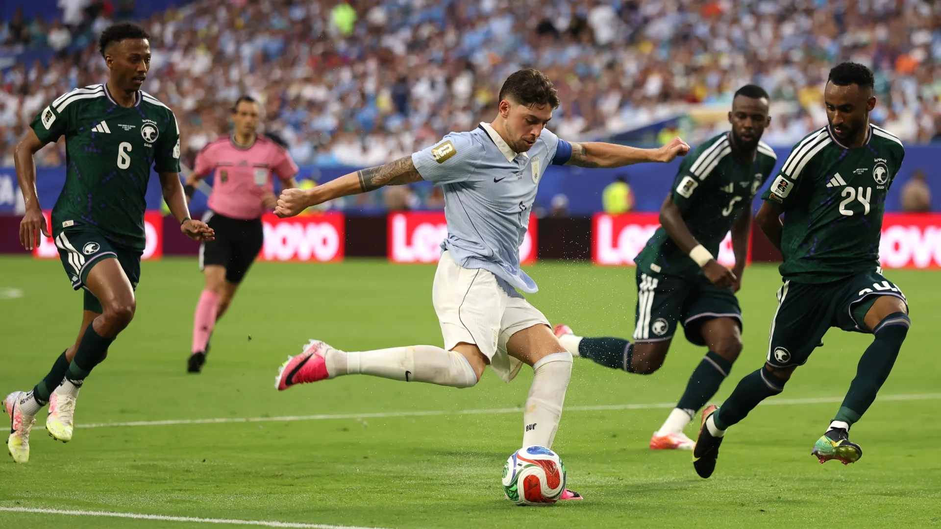 Federico Valverde #8 of Uruguay passes the ball in the game against Saudi Arabia.