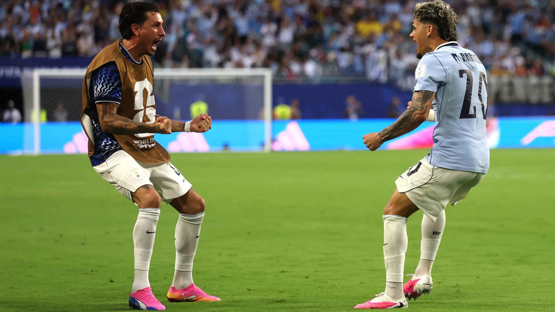 Maxi Araujo #20 of Uruguay celebrates with teammate Jose Maria Gimenez.