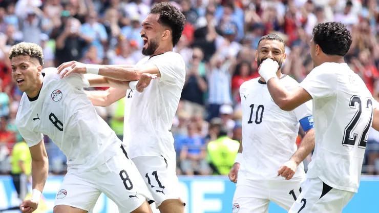 Emam Ashour #8 of Egypt celebrates with teammates.