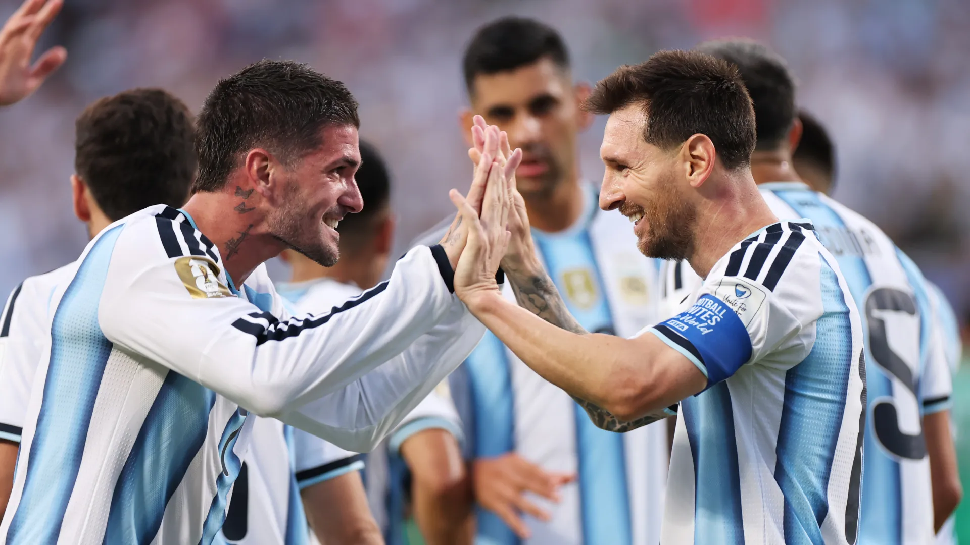 Messi and De Paul celebrating
