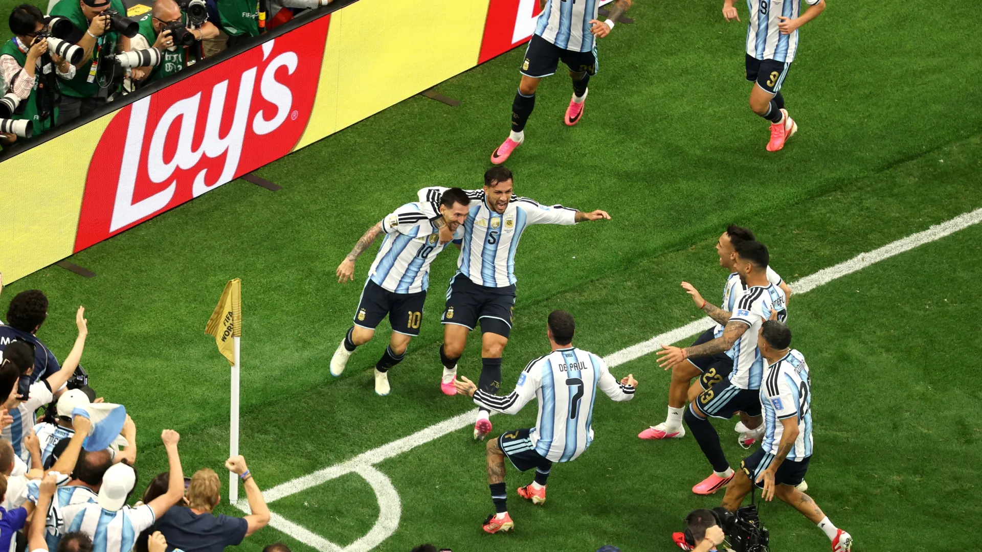 Lionel Messi #10 of Argentina celebrates with teammates after scoring against Austria.