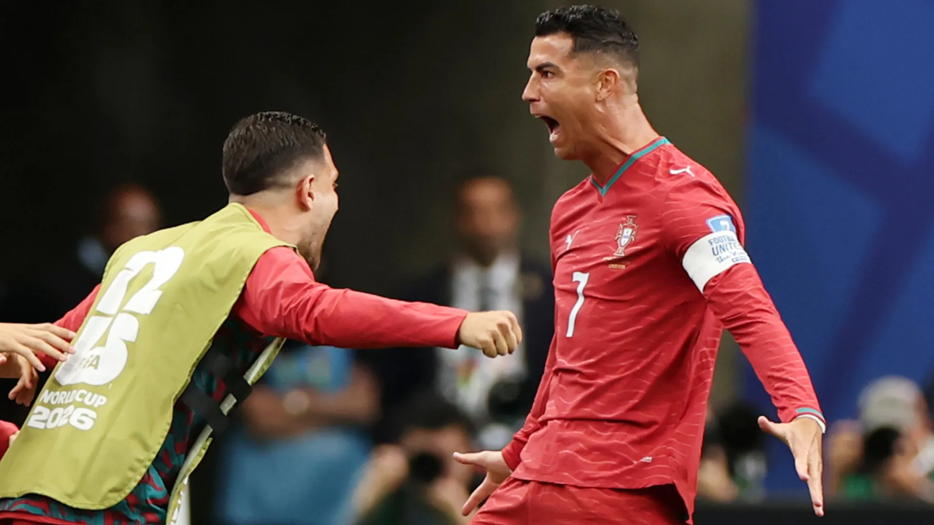 Cristiano Ronaldo #7 of Portugal celebrates with teammates after scoring a goal.