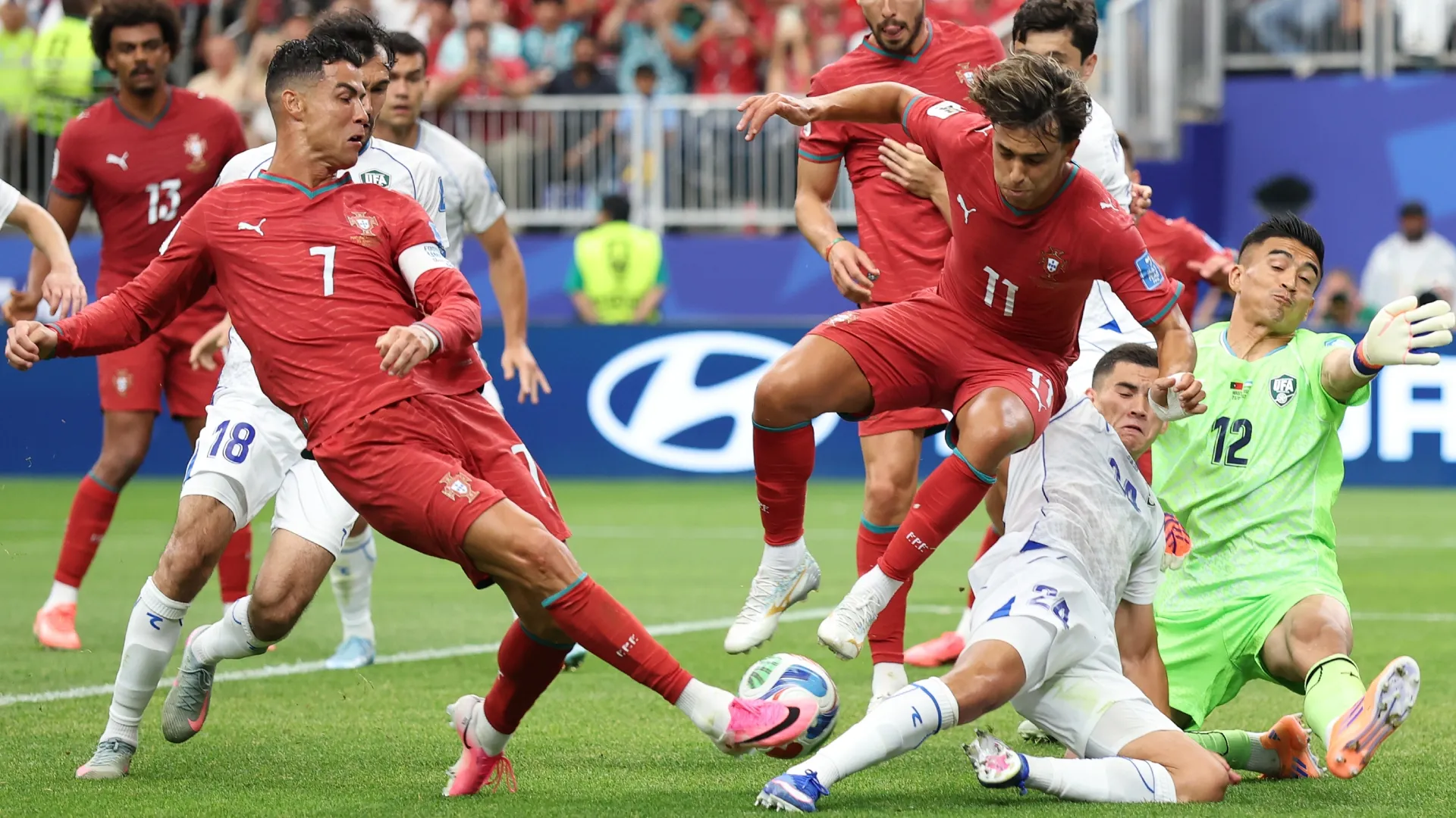 Cristiano Ronaldo #7 of Portugal shoots resulting in an own goal.