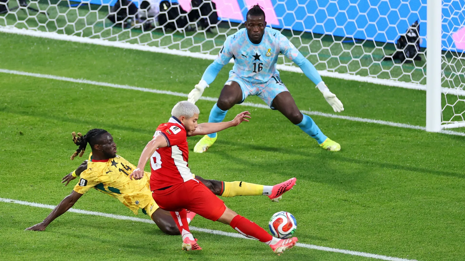 Cristian Martinez #6 of Panama shoots at goal while Gideon Mensah #14 of Ghana attempts to block.