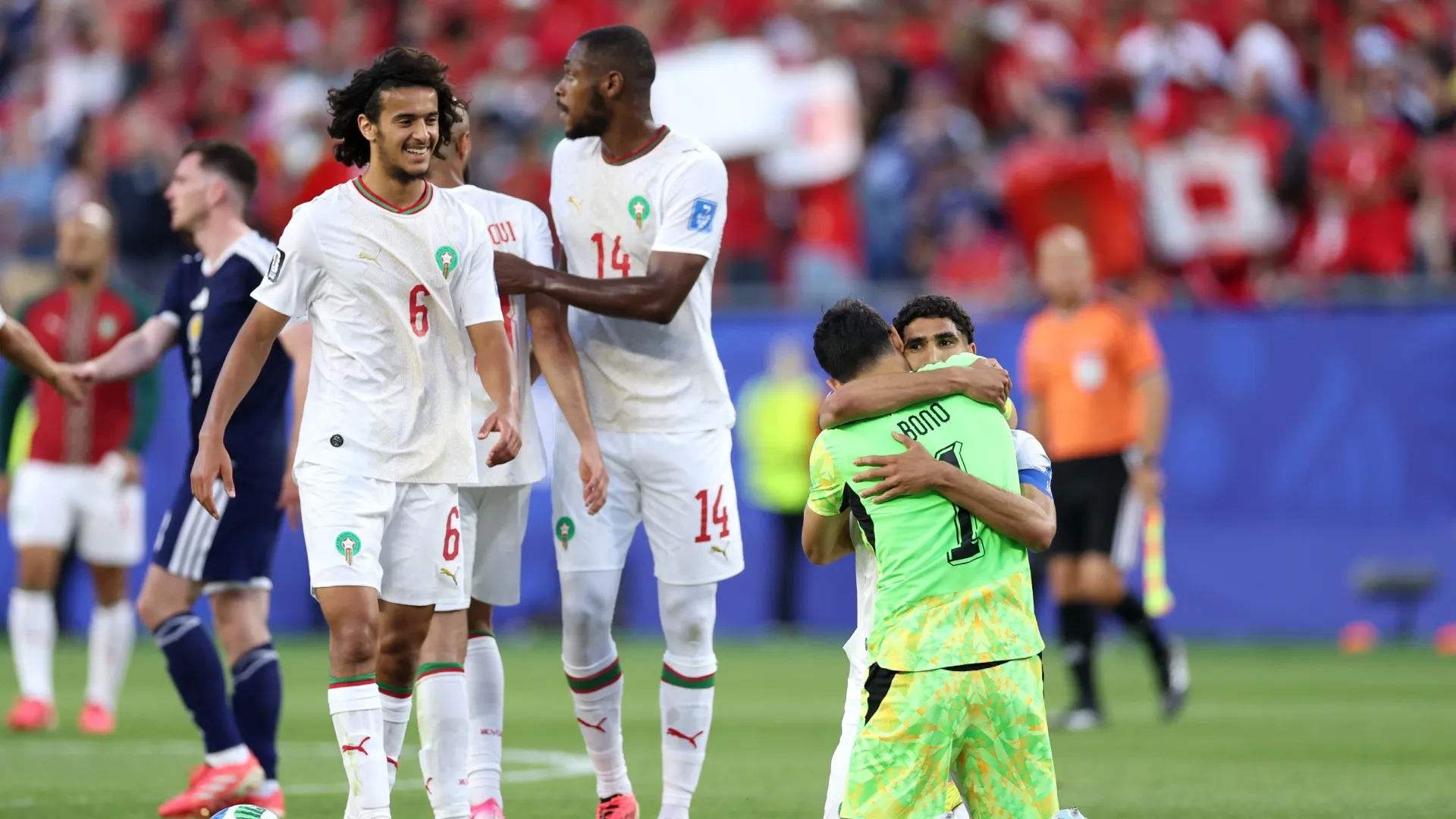 Players of Morocco celebrate the team's 1-0 victory against Scotland.
