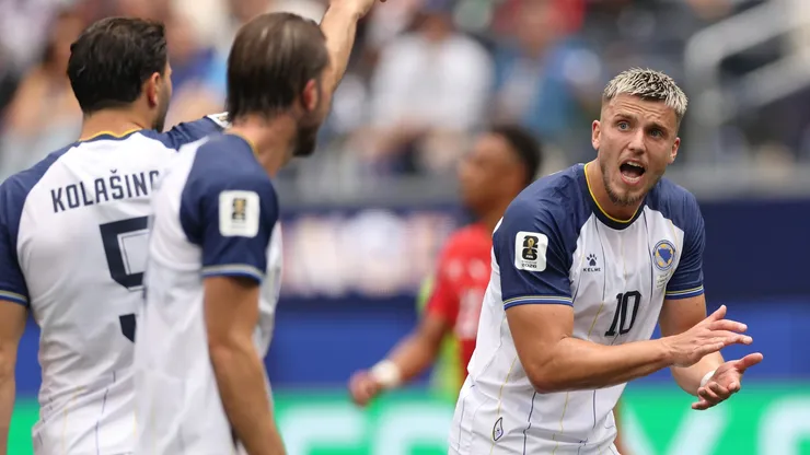 Ermedin Demirovic of Bosnia and Herzegovina encourages his team mates.