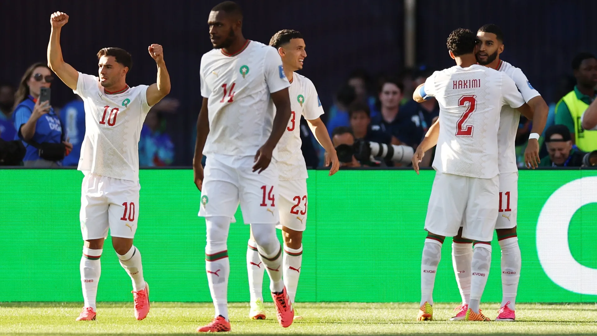 Ismael Saibari (1st R) #11 of Morocco celebrates with teammates after scoring.