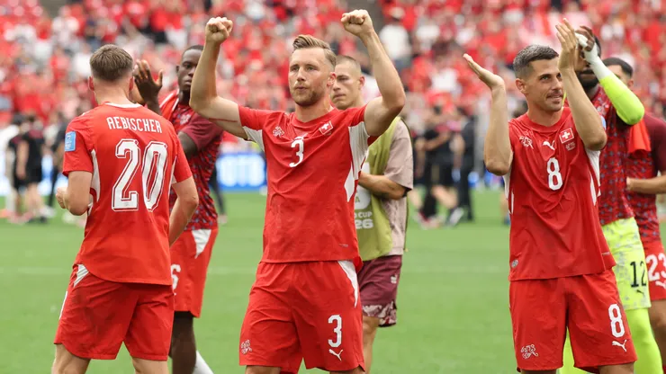 Silvan Widmer #3 and Remo Freuler #8 of Switzerland applaud fans.