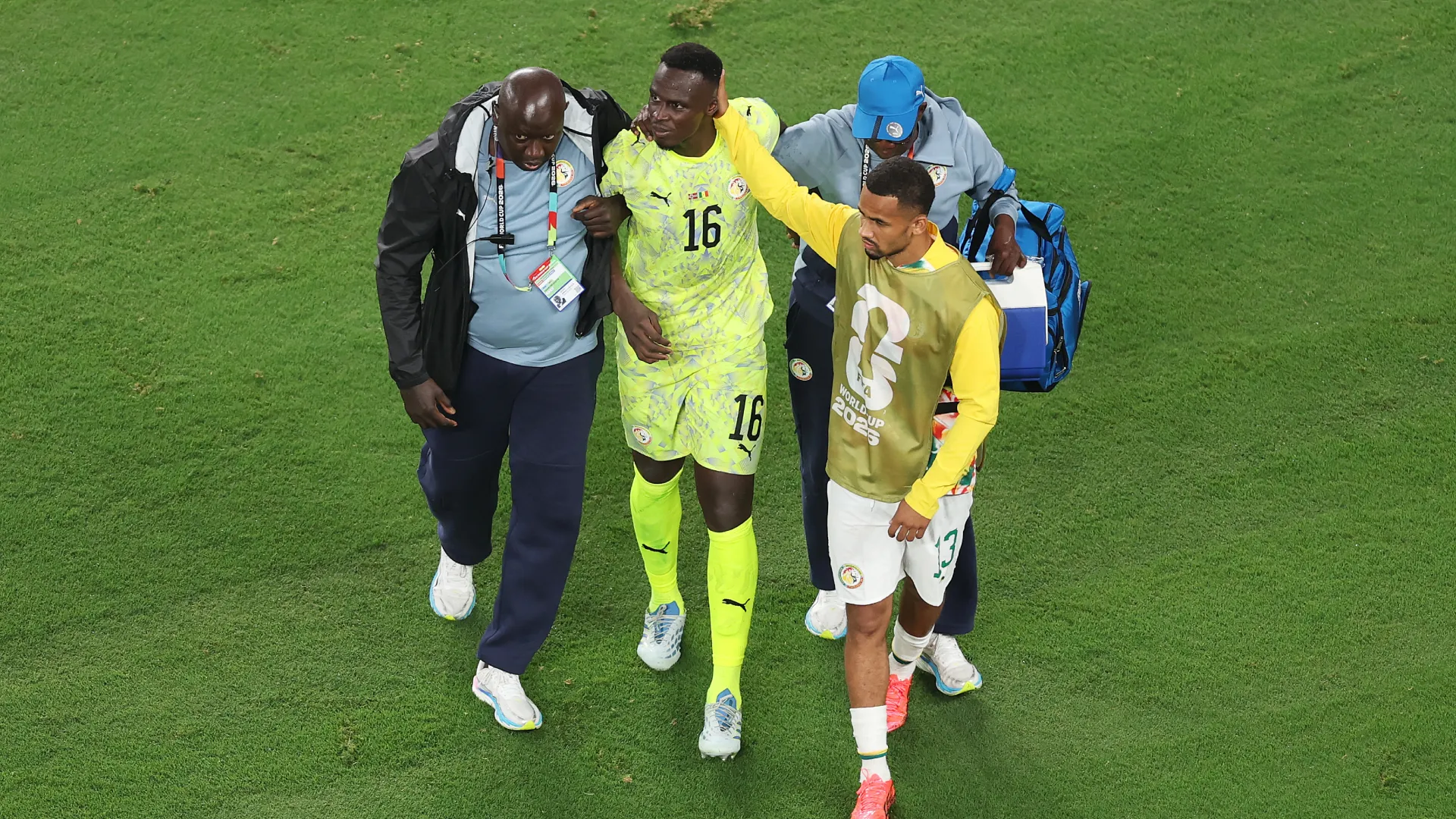 Edouard Mendy #16 of Senegal is helped by team staff as he leaves the pitch (Getty Images).