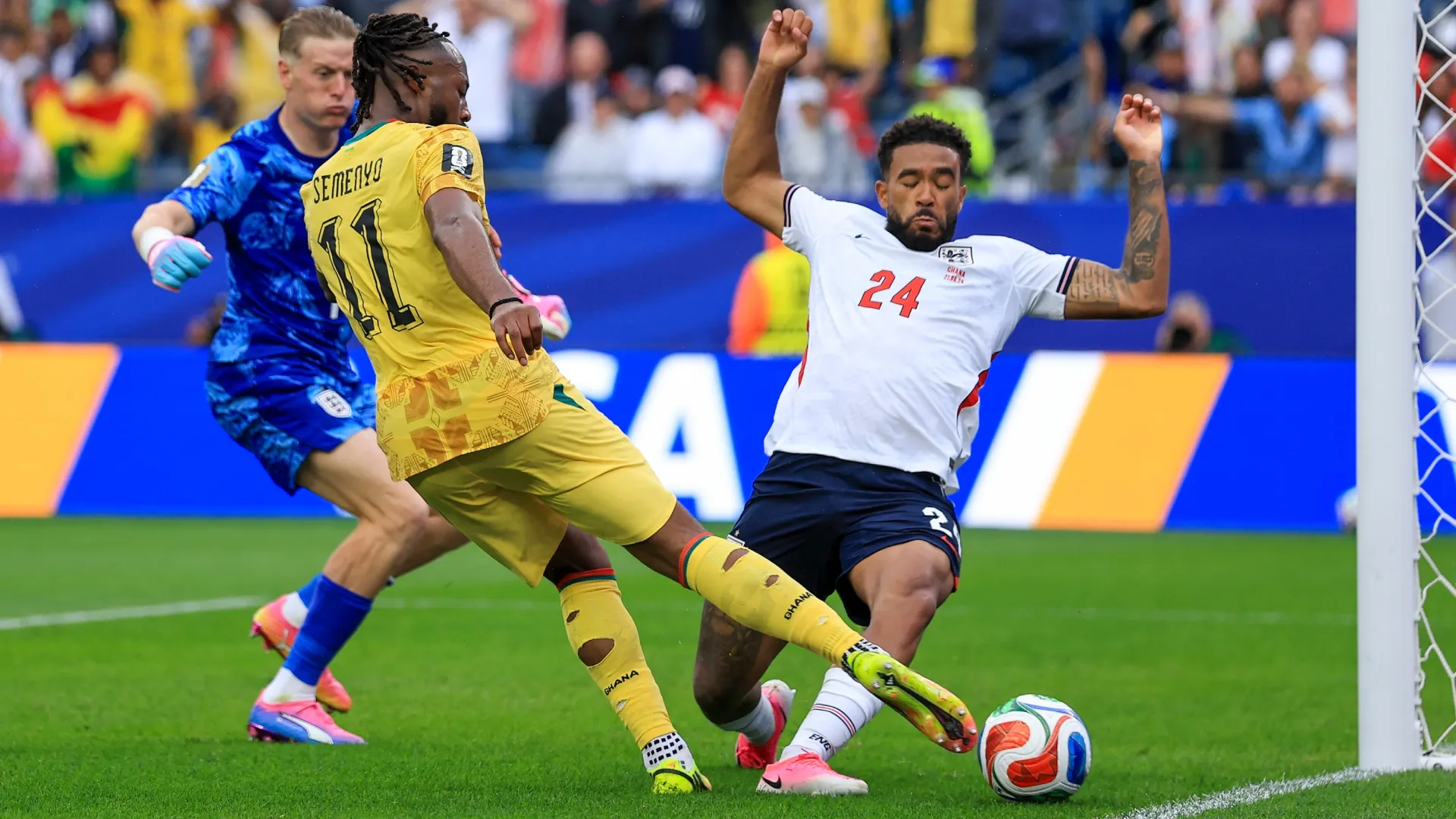 Antoine Semenyo #11 of Ghana attempts to shoot, blocked by Reece James #24 of England.