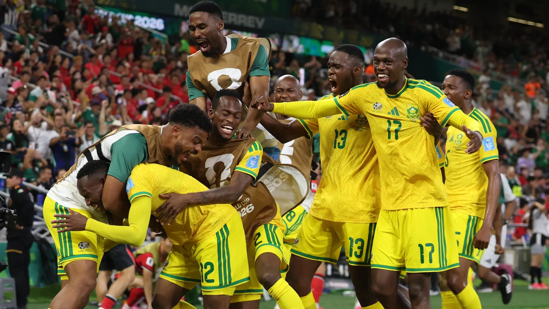 Thapelo Maseko #12 of South Africa celebrates with teammates after scoring a goal.