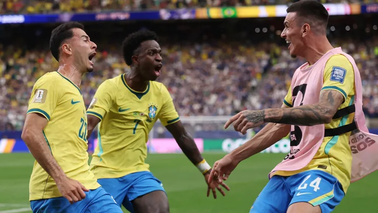 Gabriel Martinelli #22 of Brazil celebrates with teammates after scoring a goal.