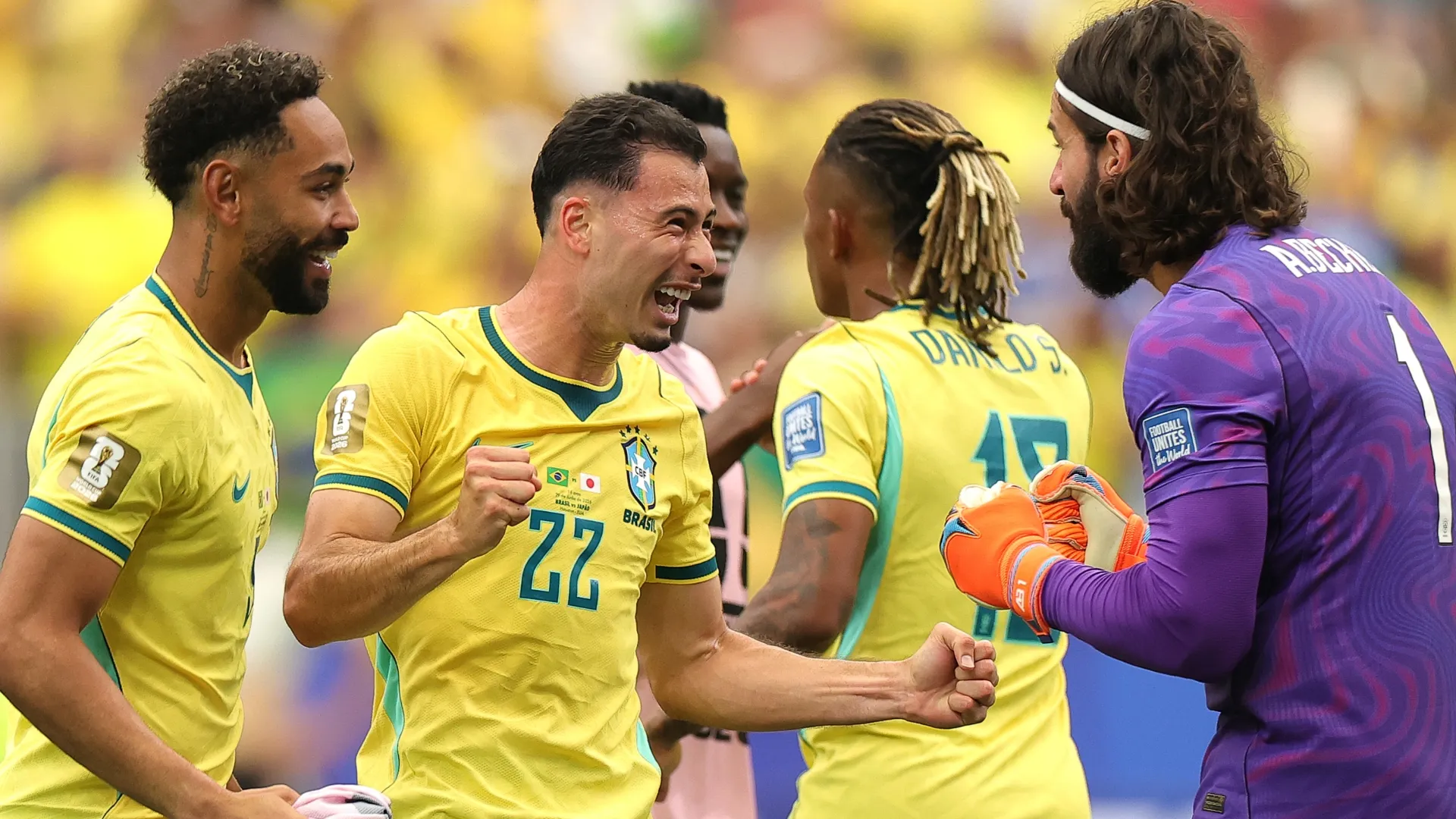Gabriel Martinelli #22 of Brazil celebrates with teammates after the 2-1 win.