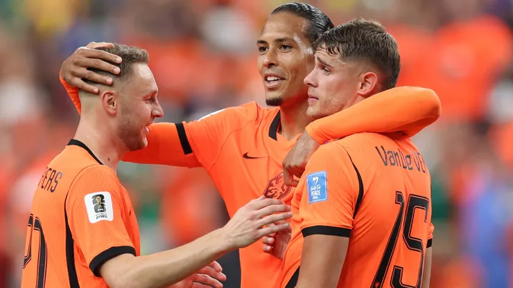 Teun Koopmeiners #20, Virgil van Dijk #4 and Micky van de Ven #15 of Netherlands celebrate the team's 5-1 victory.