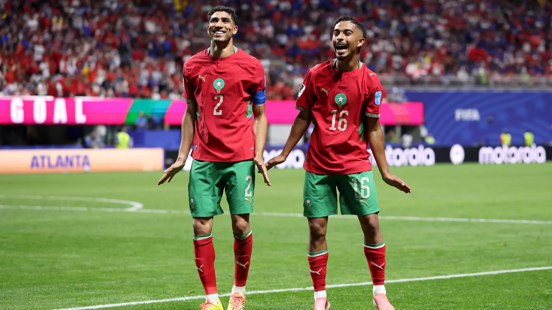 Gessime Yassine celebrates with Achraf Hakimi after scoring a goal. (Getty Images)