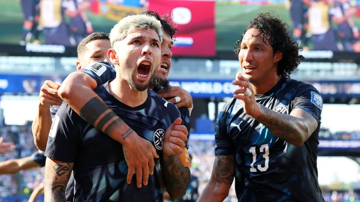 Julio Enciso #19 of Paraguay celebrates with teammates.