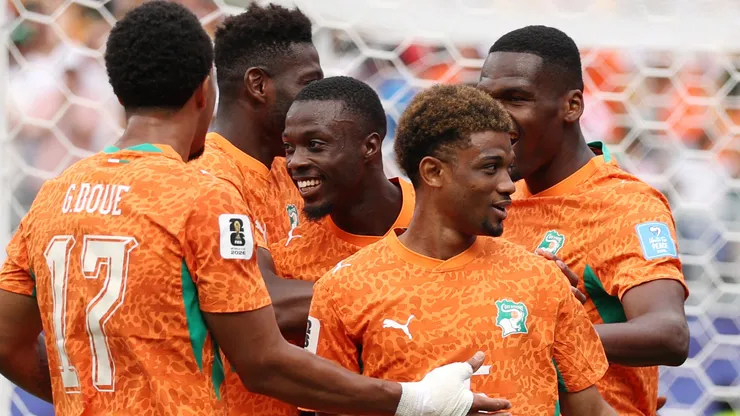 Nicolas Pepe #19 of Cote d'Ivoire celebrates with teammates after scoring a goal.