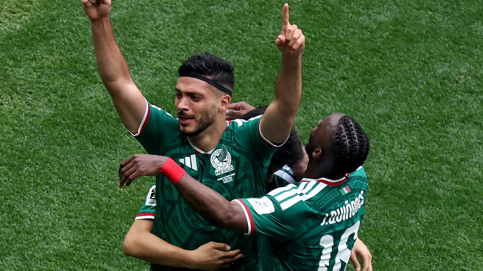 Raul Jimenez #9 of Mexico celebrates with teammates after scoring a goal.