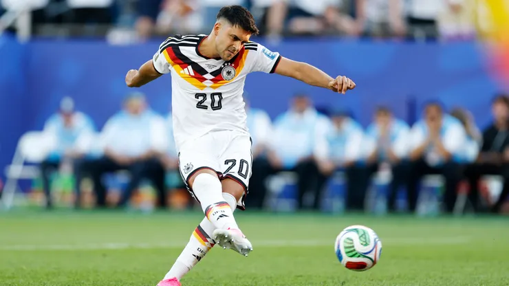 Nadiem Amiri #20 of Germany takes a penalty against Paraguay.