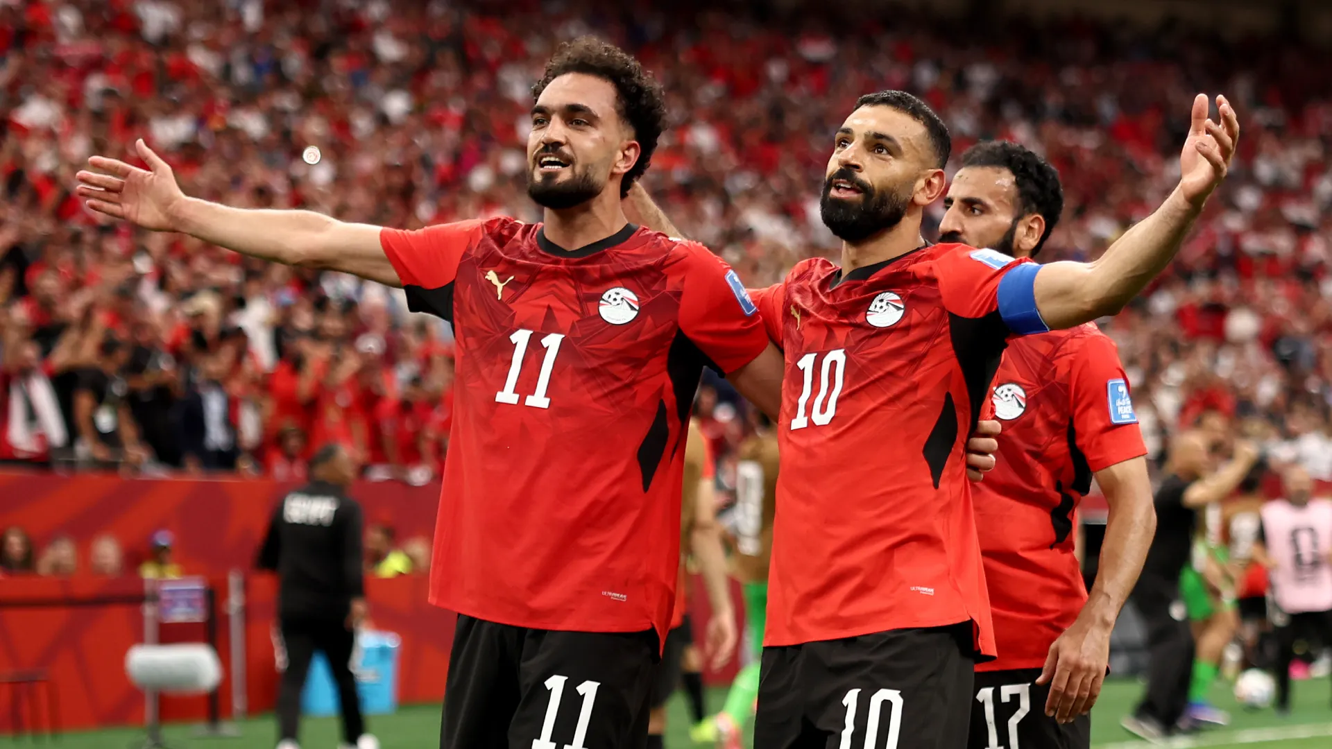 Mohamed Salah #10 of Egypt celebrates with Mostafa Zico
