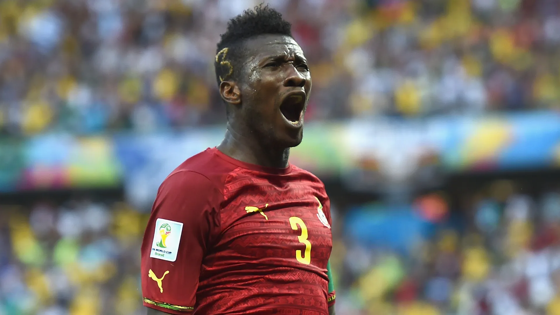 Asamoah Gyan of Ghana celebrates a goal during the 2014 World Cup. (Getty Images)