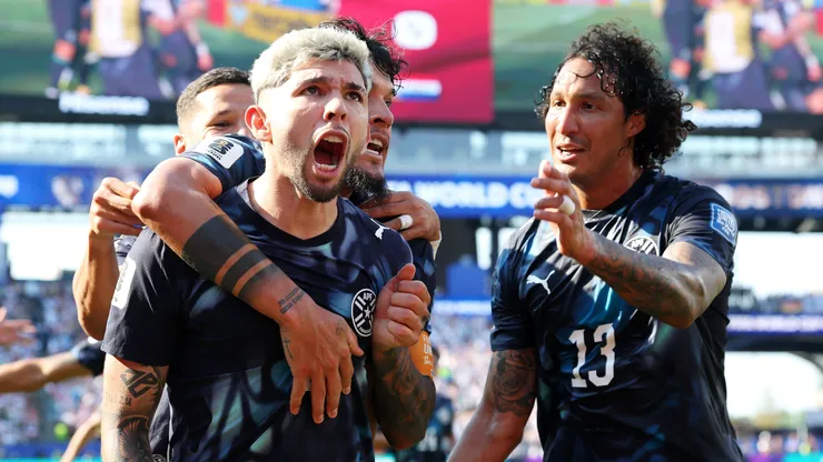 Julio Enciso #19 of Paraguay celebrates with teammates.