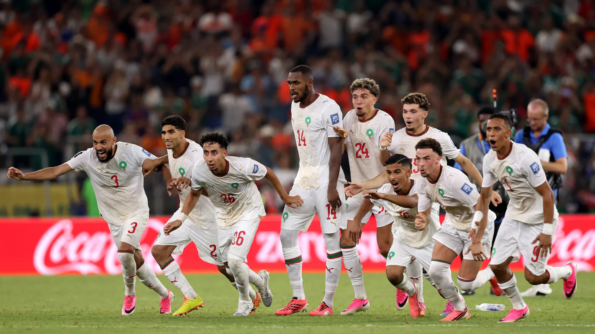 Players of Morocco celebrate after defeating the Netherlands through a penalty shootout. (Getty Images)