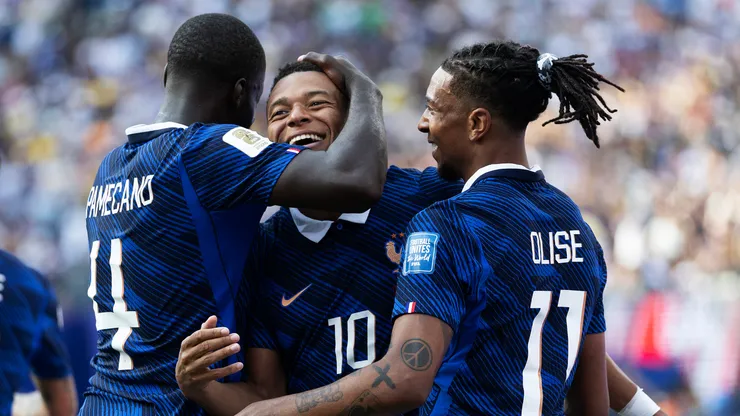 Kylian Mbappe #10 of France celebrates with Dayot Upamecano #4 and Michael Olise #11.