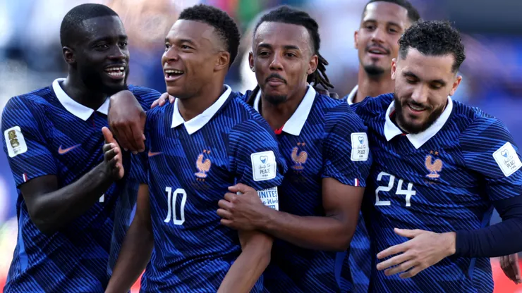 Kylian Mbappe #10 of France celebrates with teammates after scoring