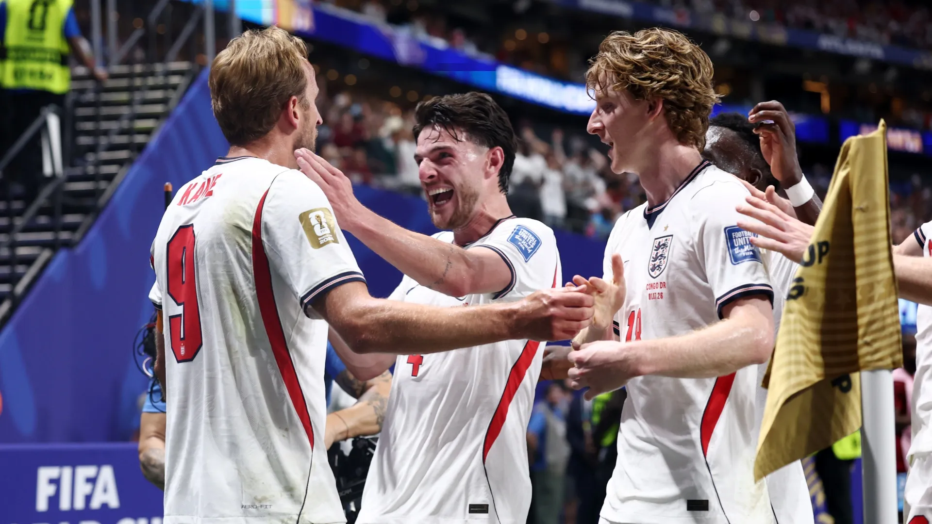 Harry Kane #9 of England celebrates with teammates Declan Rice #4 and Anthony Gordon #18.