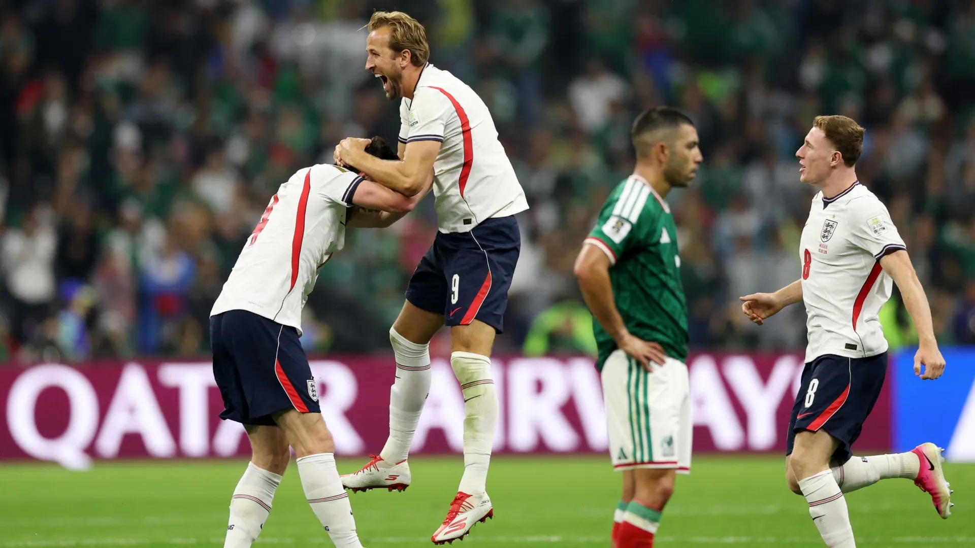 Declan Rice #4, Harry Kane #9 and Elliot Anderson #8 of England celebrate the team's 3-2 victory.