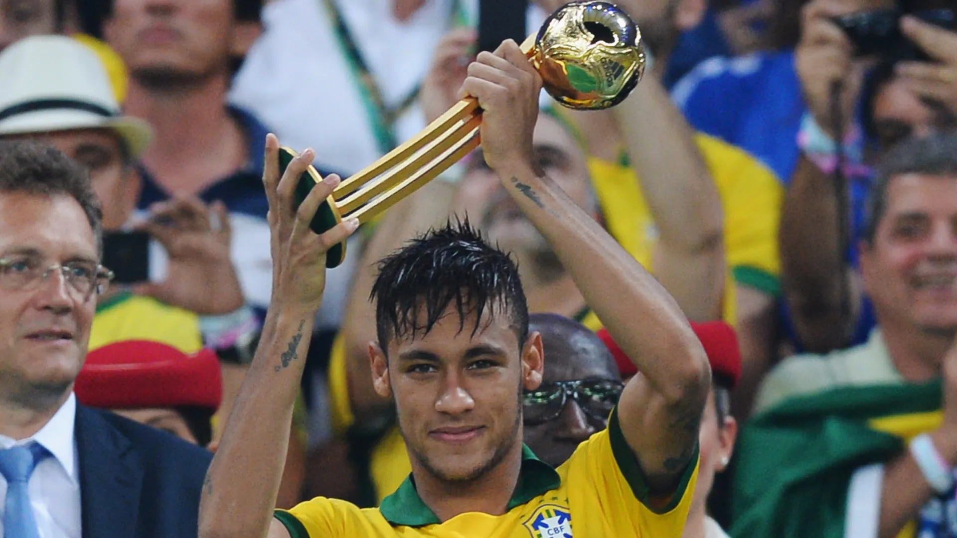 Neymar of Brazil celebrates with the adidas Golden Ball award after the FIFA Confederations Cup Brazil 2013 Final