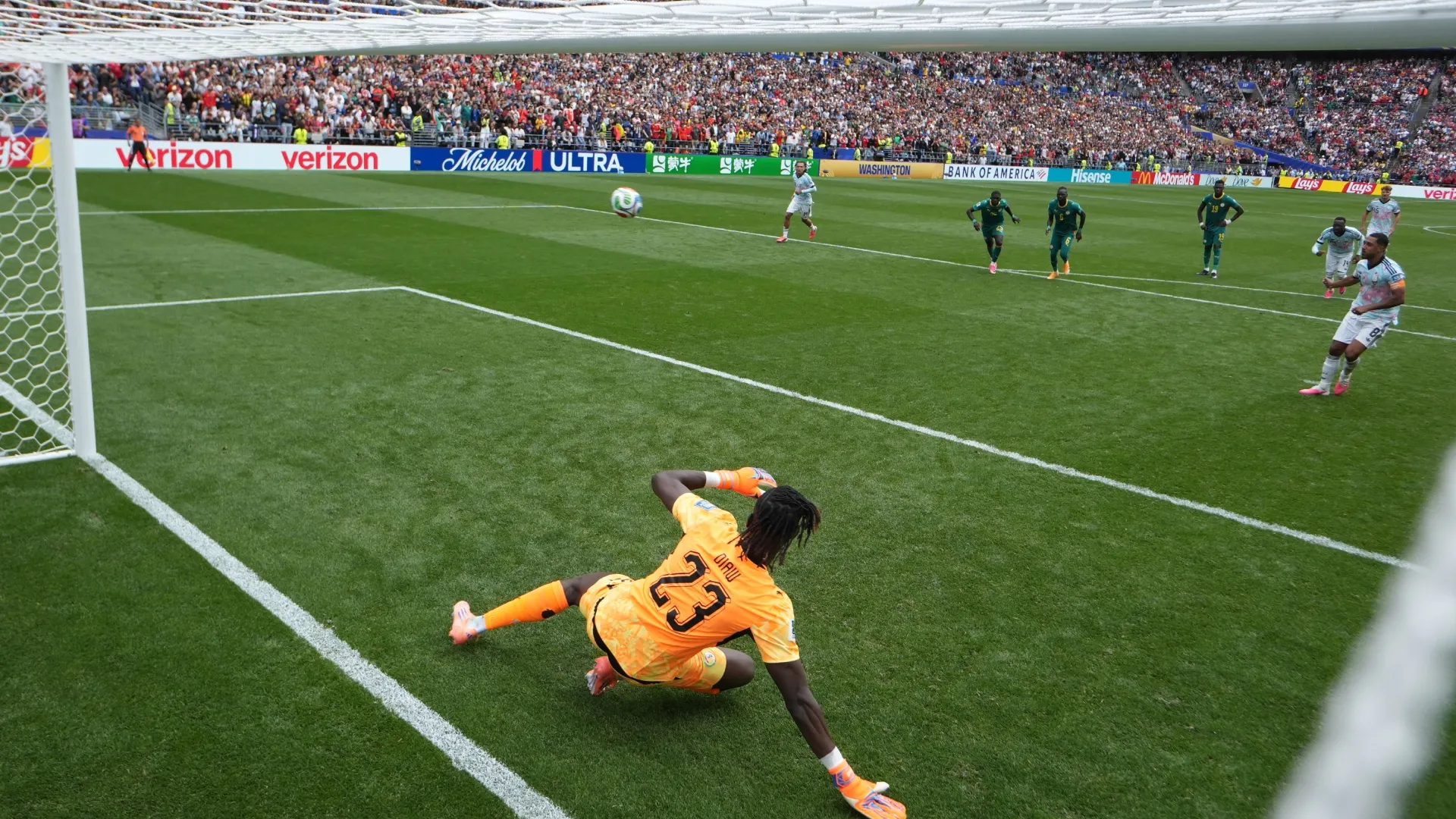 Youri Tielemans #8 of Belgium converts the winning penalty against Senegal.