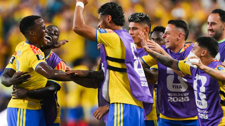 Jhon Arias #11 of Colombia celebrates with teammates after scoring a goal.