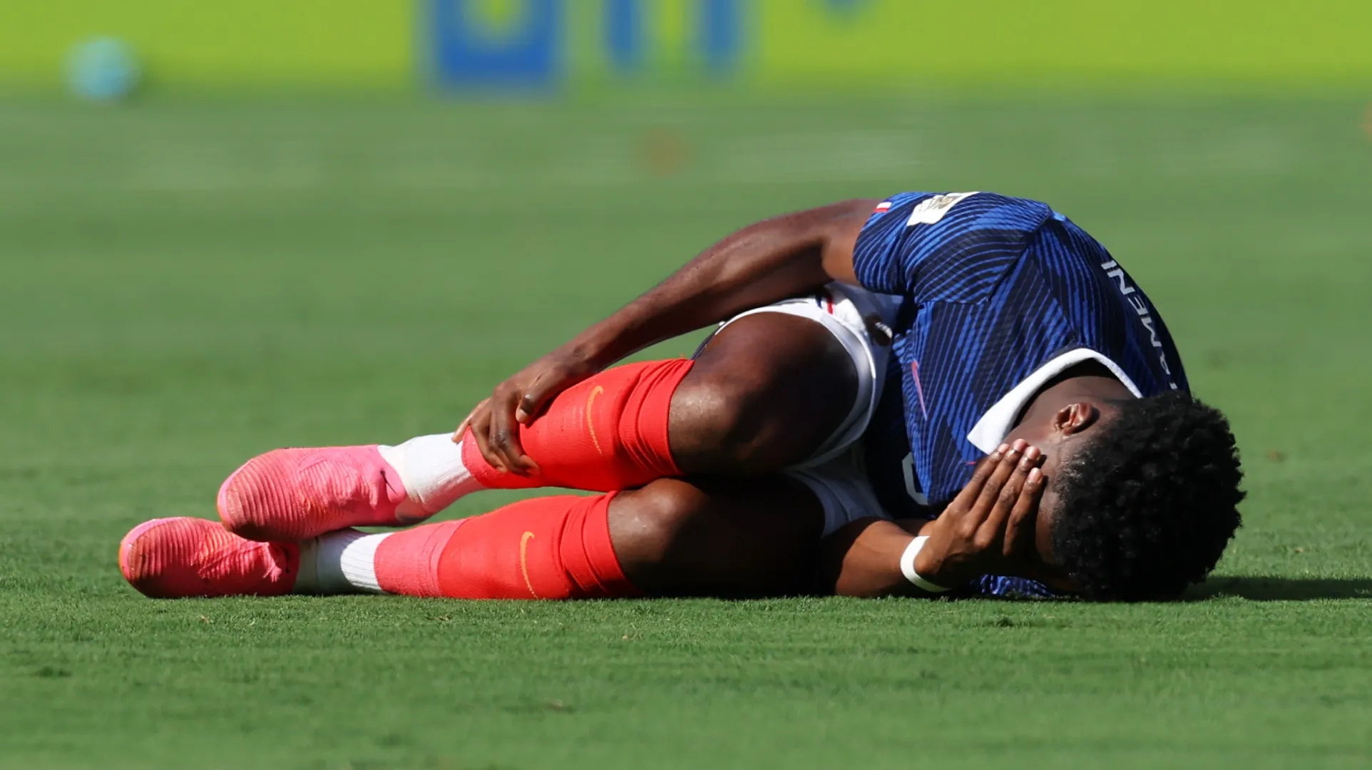 Aurelien Tchouameni #8 of France lying on the floor after a foul against Sweden.