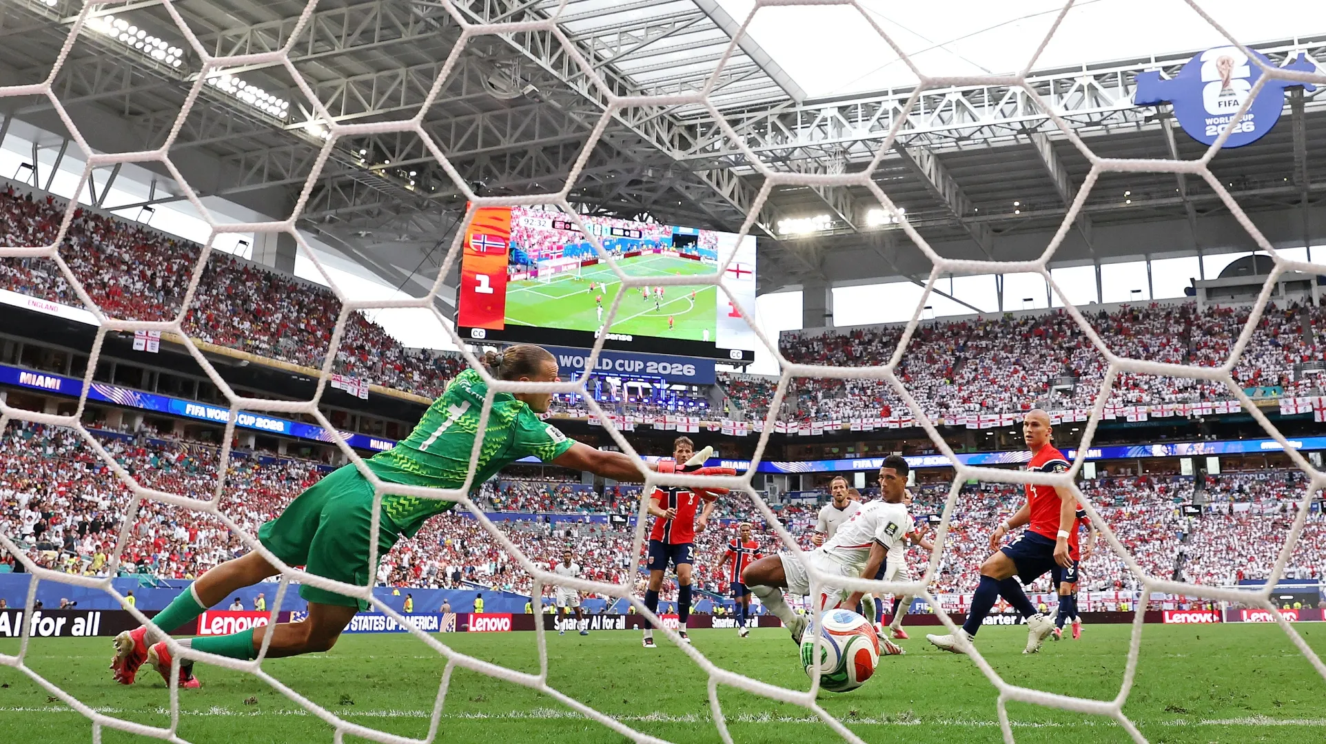 Jude Bellingham #10 of England scores his team's second goal past Orjan Nyland #1 of Norway.