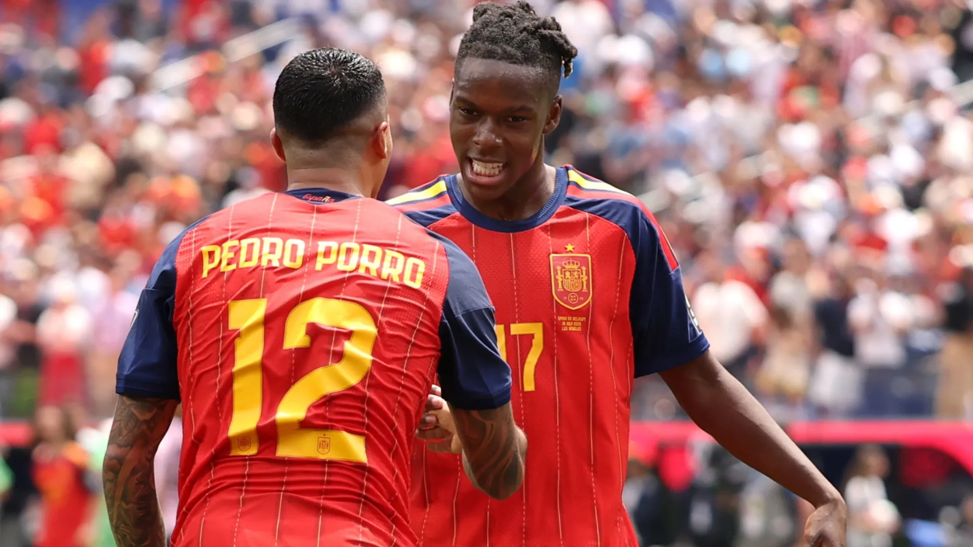 Pedro Porro #12 and Nico Williams #17 of Spain celebrate.