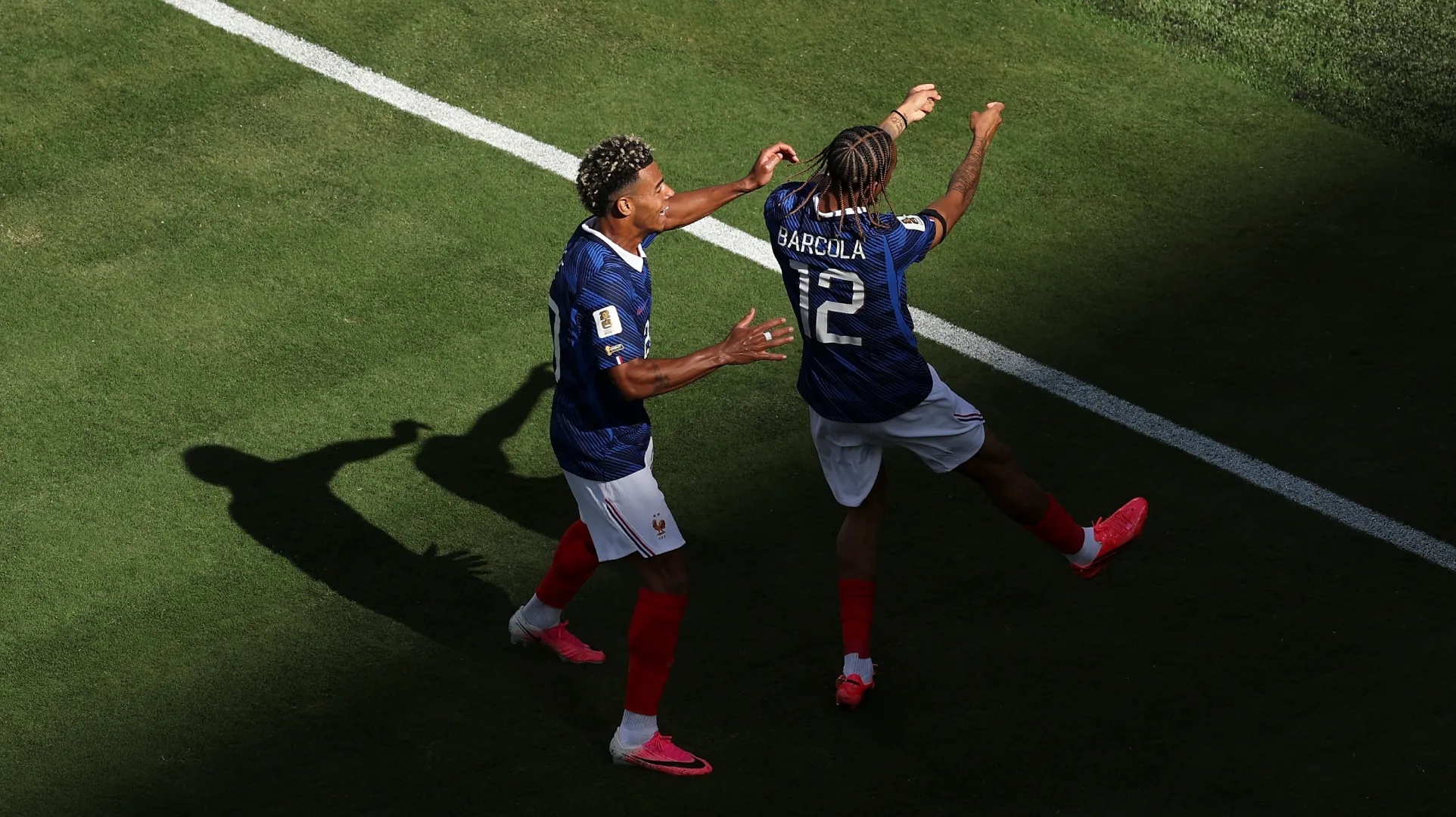Bradley Barcola #12 of France celebrates with Desire Doue #20 after scoring.