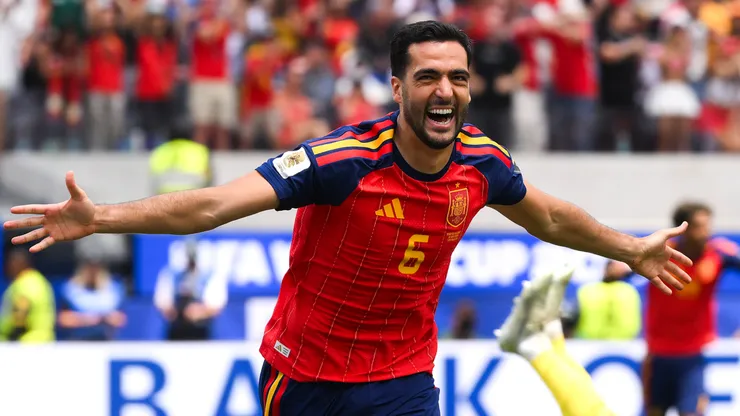 Mikel Merino celebrates a goal for Spain.