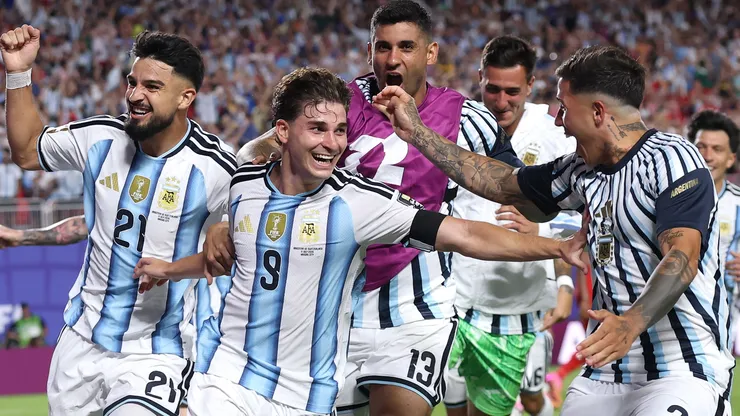 Julian Alvarez #9 of Argentina celebrates with teammates after scoring a goal.