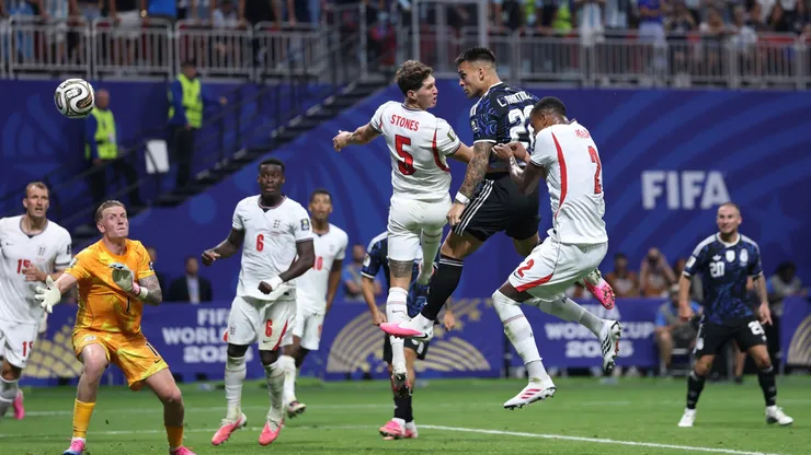 Argentina's Lautaro Martinez scores with a header against England.