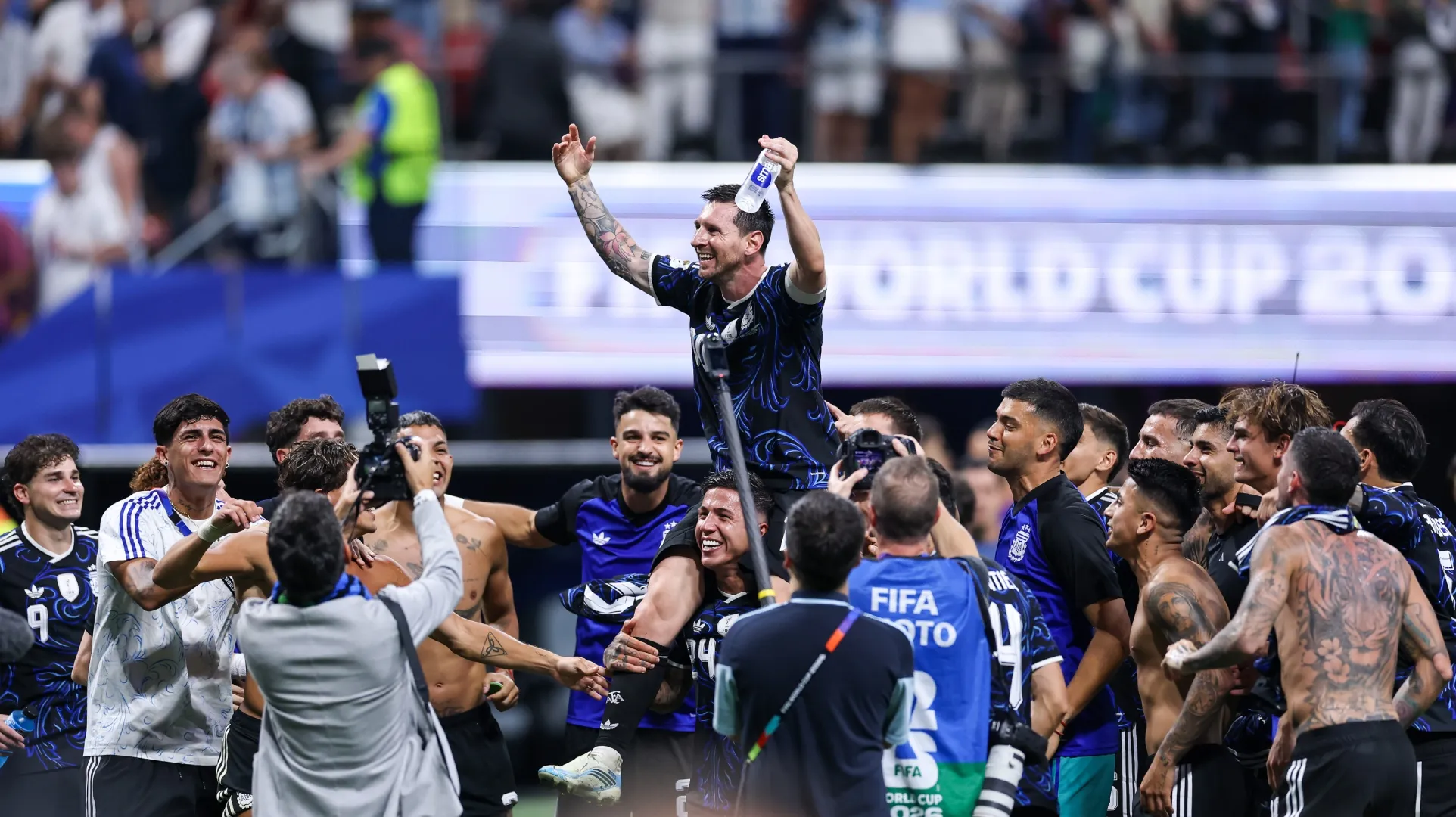 Lionel Messi #10 of Argentina celebrates with teammates after the 2-1 win against England.