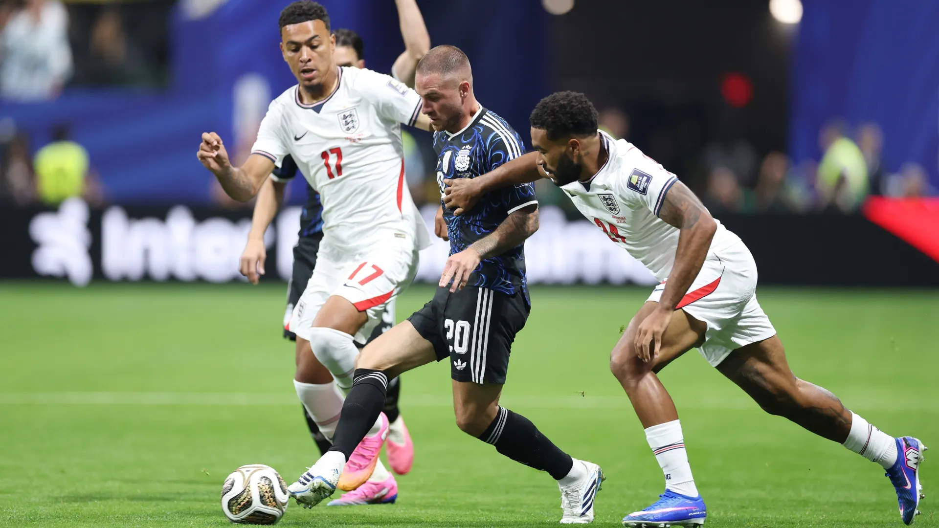 Alexis Mac Allister #20 of Argentina controls the ball against Reece James #24 of England.