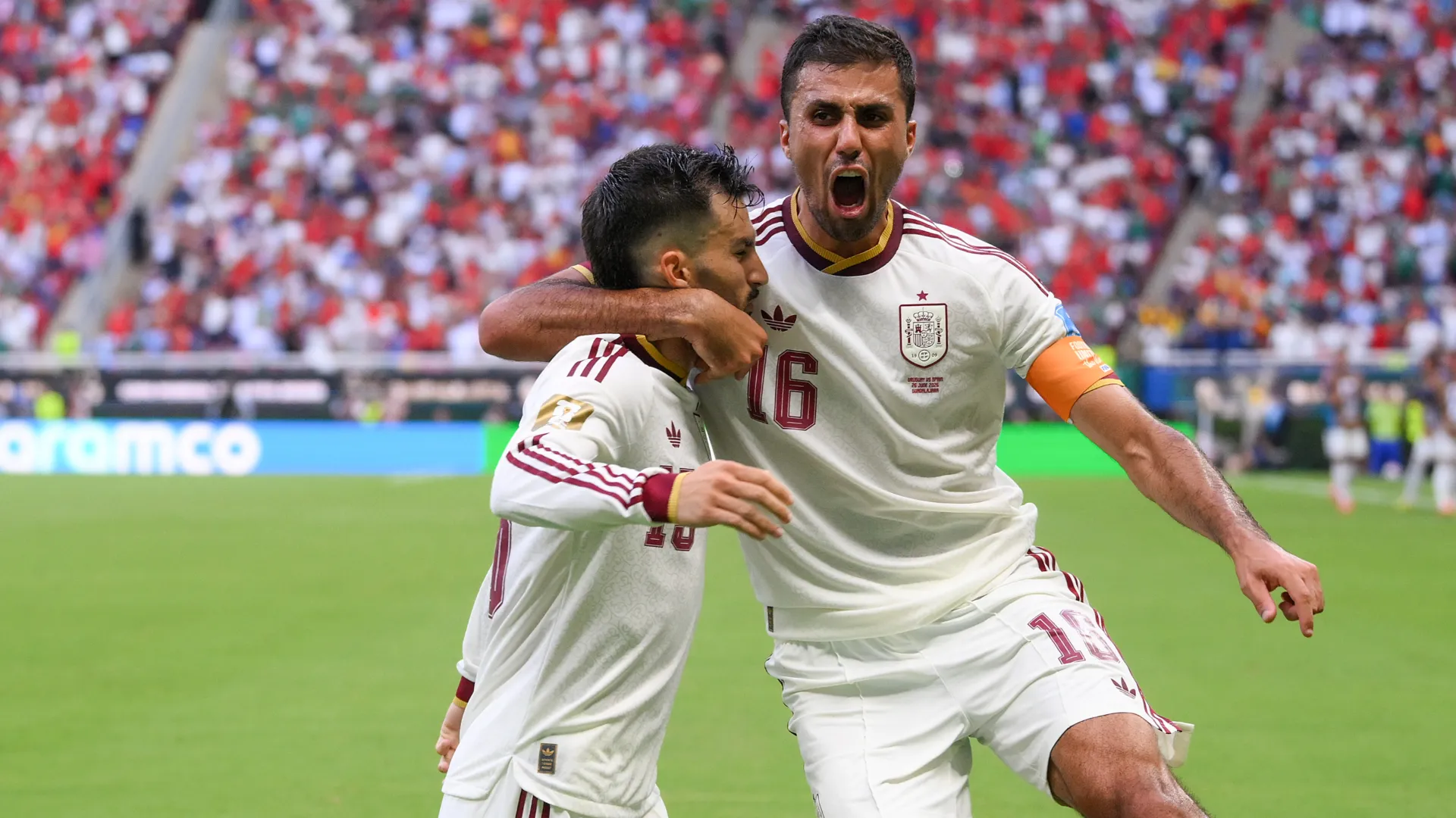 Alex Baena #15 of Spain celebrates a goal with teammate Rodri #16. (Getty Images)