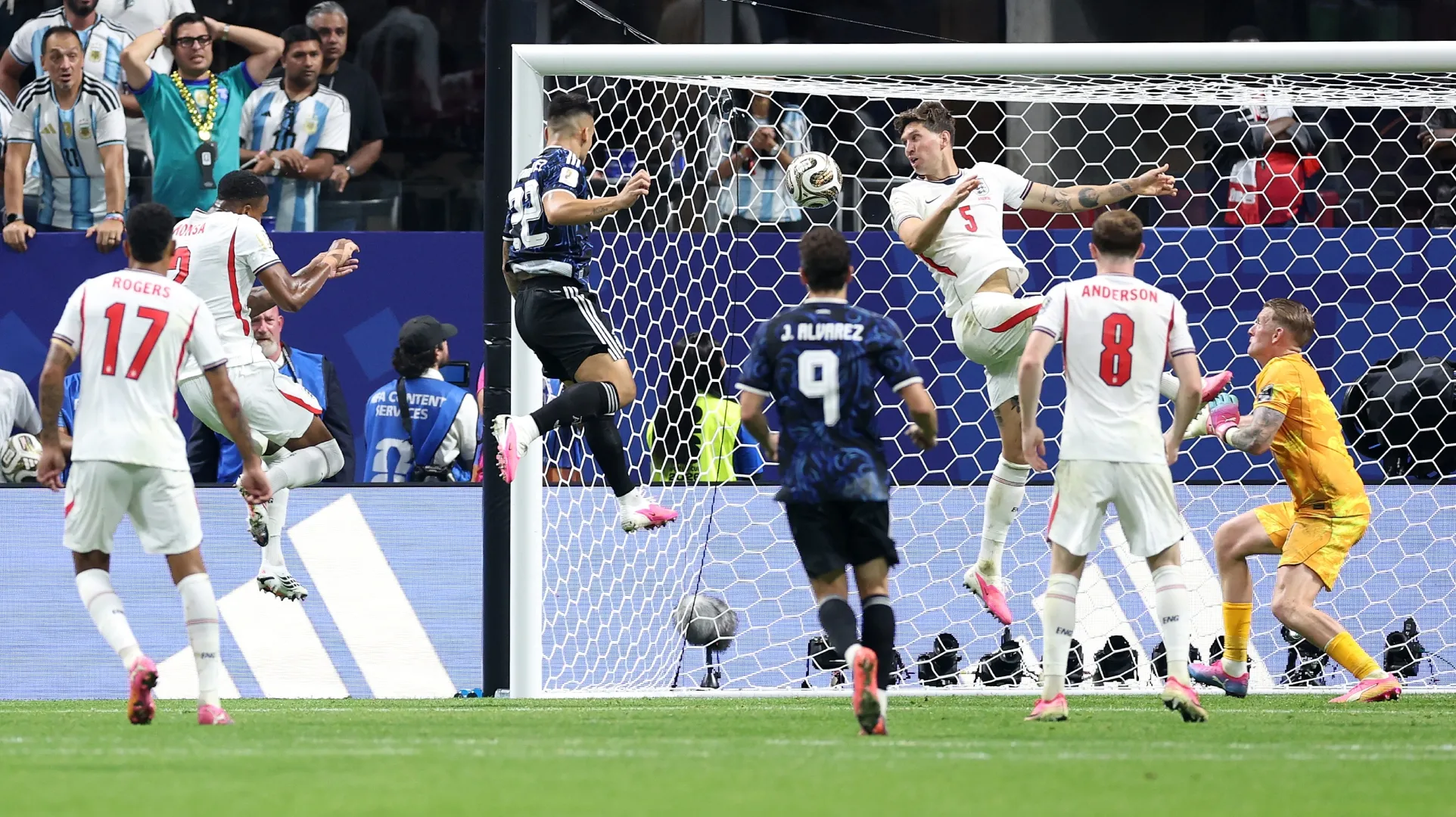 Lautaro Martinez #22 of Argentina scores against England.