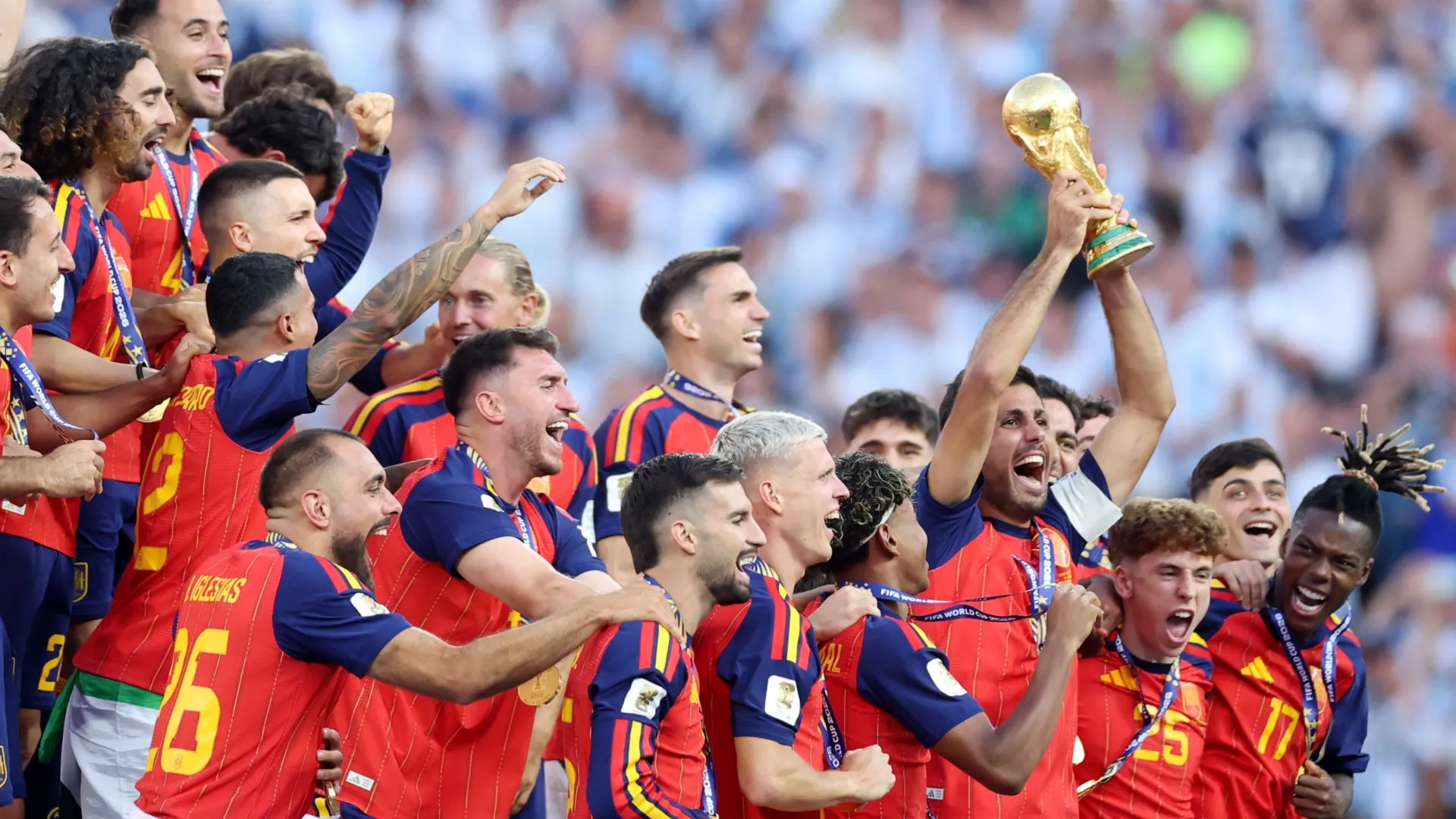 Rodri #16 of Spain lifts the FIFA World Cup Winner’s Trophy.
